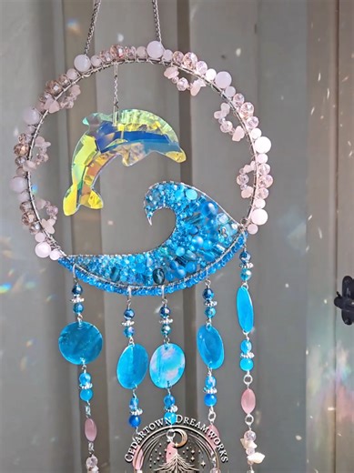 A custom dolphin suncatcher with rose quartz, blue agate, pink cats eye, and sea shells. This piece took me approximately 10 hours over the course of 3 days. I poured every bit of me into this one. It gave me so many issues, and there were so many parts I had to take off, re-do, over and over again. The thing about custom orders is...they take much longer than other pieces I just make myself. One part of it is that I am overly picky in order to please the customer, since it is such an honor to h