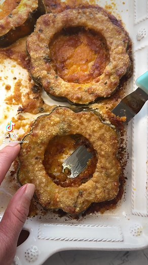CRISPY PARM ACORN SQUASH RINGS Give them a shot and tell me what you think. 2 small acorn squash (or delicata squash) rinsed, deseeded and sliced 1/4 cup olive oil 1/2 tsp smoked paprika 1/2 tsp crushed red pepper 1/2 tsp garlic powder 1/2 tsp salt 1/4 cup chopped parsley 1 cup grated parm Preheat oven to 425F -Mix together olive oil, crushed red pepper, garlic powder, salt & parsley. -Place grated parm in a bowl. -Toss squash in olive oil mixture, the press both sides into the grated parm and i