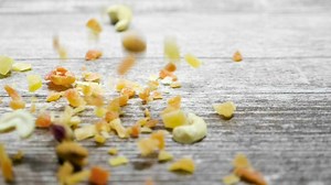 Mixed nuts falling onto a table - Free Stock Video