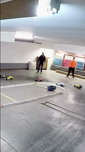 Indoor Oval RC racing mudboss on a concrete floor