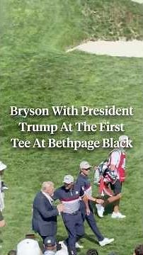 President Trump walks onto the first tee alongside Bryson DeChambeau.
