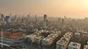 Mumbai: Aerial view of famous city in India at sunrise, modern city skyline with skyscrapers - landscape panorama of South Asia from above
