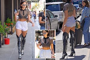 Dua Lipa carries bottle of water to cool off while she sizzles in cowboy boots