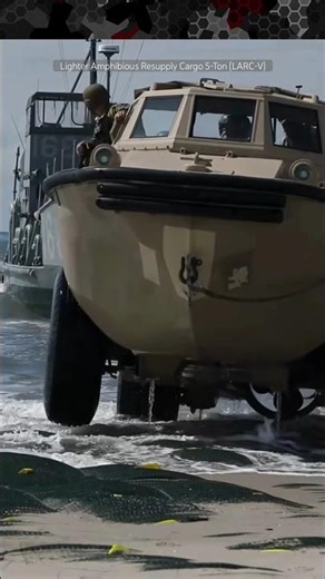 LARC-V Amphibious Vehicle Offloads from Landing Craft Utility (LCU) with Marines