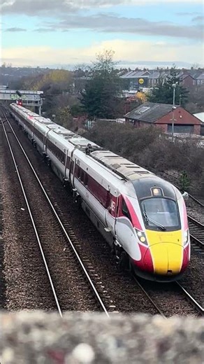 A lner azuma 9 car during the Durham coast line diversions passing under Pelaw footbridge