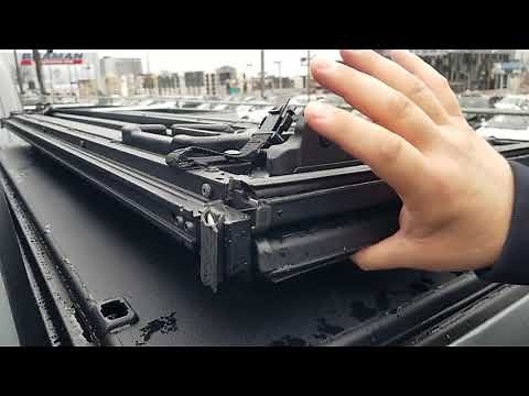 Toyota Tacoma demonstration of factory tri fold tonnau cover use and removal