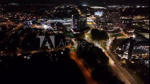 Basingstoke, UK. 28th October 2025. An aerial night capture of Basingstoke Town centre with Festival Place shopping centre, retail facilities , commercial and residential buildings.