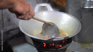 Preparing tongseng kambing. Tongseng is an Indonesian Central Java goat meat muttonor beef stew dish in curry-like soup with vegetables and sweet soy sauce. Preparing Goat Curry or Lamb Curry