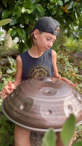 Picking good vibrations 😆🍊 sound can stimulate plant cells making them grow bigger and healthier, so good vibration here we come 🛸🎶 Merch Sale! Pick up bargain tanks/singlets for the Aussie winter sale.. Www.Sunnisessionz.com/shop #goodvibrations #plants #music #sale #merch #handpan #sunniholden #pantam #garden | Sunnisessionz