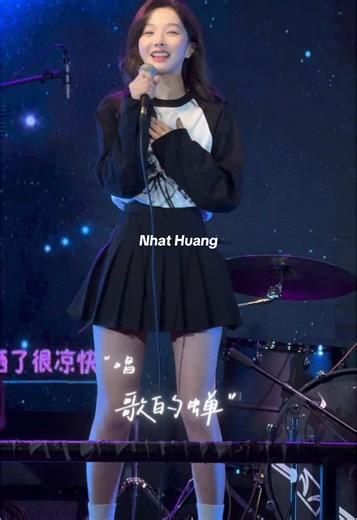 Young Woman's Energetic Performance on Stage