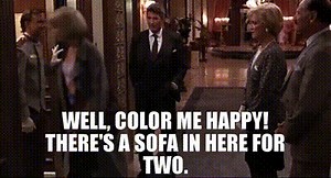 Well, color me happy! There's a sofa in here for two.