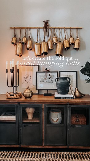 if you have a ton of these bells at home already, this is super easy to make!! and it you need a few more, comment BELLS and I’ll send you everything you need to make your own hanging bell display! 🔔 you could put as many or as little bells as you’d like! ✨like and save for later! oh and share with a friend 🤎 ✨follow @styledbybeck for more holiday inspo bells, Christmas decor, viral, hanging bell display, holiday inspo, Christmas bells, cow bells, Christmas decorating ideas, dowel, DIY, DIY ho