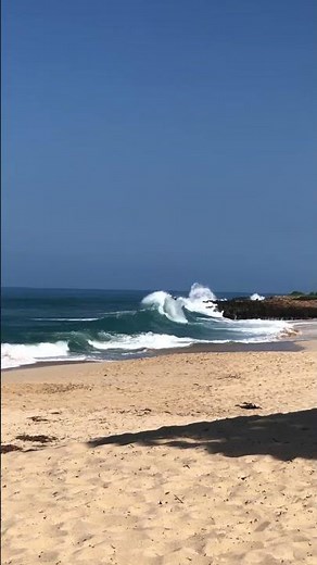 Surfer tumbles off board after big wave in Oahu, Hawaii, USA