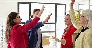 Happy employees of an international company and employees of executive team. People giving five success and leadership and winning in business