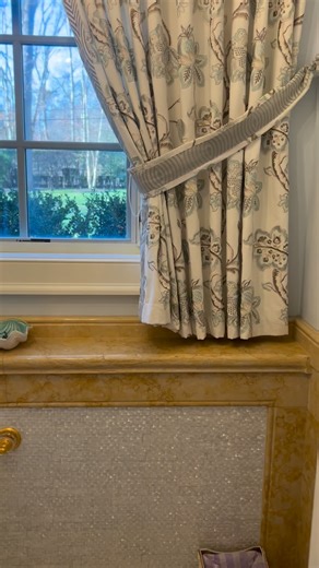 In this formal powder room, I have used a combination of mother-of-pearl mosaic on the walls, framed in classic wainscot details using Jerusalem gold limestone, followed by a brass faucet and mosaic sink, with very formal window dressing, adding unique texture and creating a cohesive design.#tommimischellhome #interiordesign #formalspaces #limestone #powderoom | Tommi Mischell