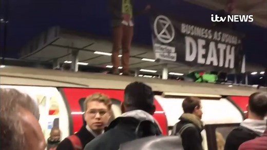Extinction Rebellion protesters dragged off the roof of tube train