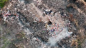 aerial view of trash burning. land with rubbish, Landfill landscape ecological damage contaminated land. plastic waste in landfills, environmental pollution problems, waste or rubbish from households Stock Video