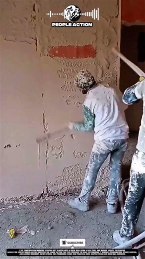 Construction People Spraying Wall Plaster During Interior Surface Finishing Action