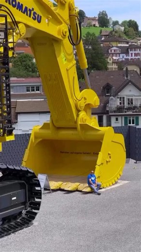 ENGINEERING ART on Instagram: "Someone had the idea of buying one of the worlds largest mining excavators and parking it in a Swiss village"