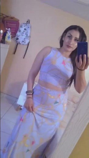 Elegant Woman in Chic Outfit: A Stunning Mirror Selfie#Fashionista #StyleInspo