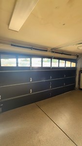 This homeowner went BIG with a solid wood garage door — heavy,...