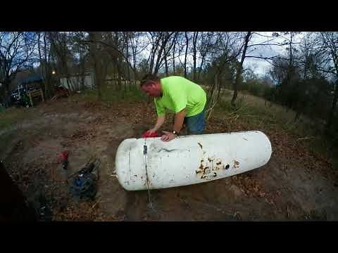 Cutting open a propane tank with a cut-off Wheel and reciprocating saw in time lapse.