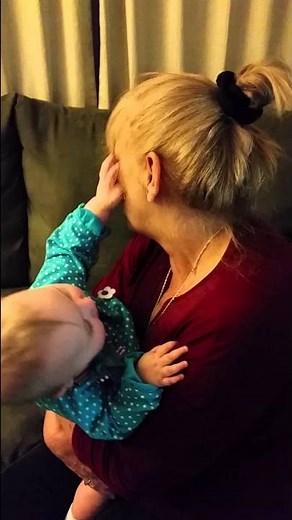 Baby giving kisses to Grandma