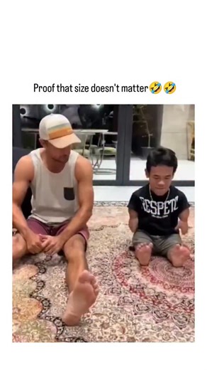 funflix on Instagram: "The video captures a small-statured man in a "RESPECT" t-shirt playfully dominating a muscular opponent in a barefoot foot-wrestling game on a rug, using agile technique to flip and control the larger man's feet, embodying the caption's humorous nod to skill trumping size in martial arts contexts. Shared by @xxxxTheKing , an account focused on inspirational martial arts clips, the post from October 22, 2025, leverages viral humor to promote empowerment, drawing from simila
