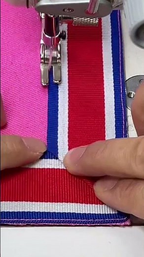 folding a piece of cloth that will be sewn using a sewing machine to make it neat