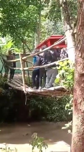 Funeral turns to horror as bridge collapse sends coffin plunging into raging waters in Peru