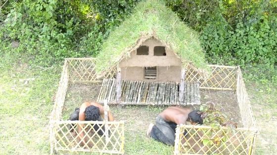 Building a beautiful bamboo dog house by hand for puppies in the forest