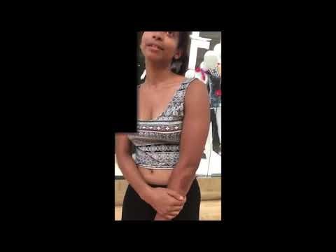 Girl receiving belly button poke