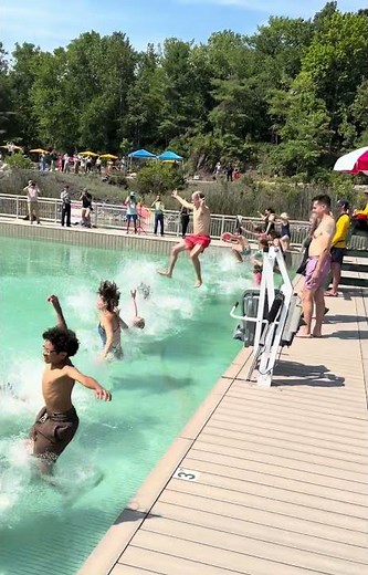 The first swimmers jump into Lake Sophia in Ulster County