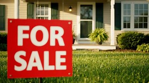 Download For Sale Sign on a Front Lawn in Front of a Suburban House During the Day for free