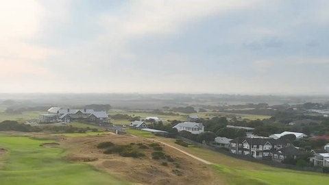 clip-3974098825-drone-footage-captures-expansive-golf-course-clubhouse