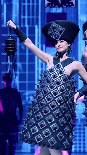 A striking ensemble manufactured from repurposed industrial supplies. Industrial Chic by Australia designer Jill Perry is a thoughtful mosaic of rubber plumbing flash rites. Credit: Industrial Chic, Jill Perry, Australia | World of WearableArt (WOW)