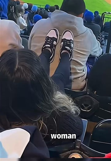 Wackos EVERY WHERE!!At a sporting event, this woman decides that she’s going to plant her feet on the back of the guy sitting in front of her. He ignores it largely until he’s finally had enough and makes a call to the police who comes and arrests her. As she’s being led away from him, she gives him one last kick to the back.People are speculating that she’s either crazy and singled him out or they have a history. My guess is they had some kind of interaction prior to the game, maybe at concessi