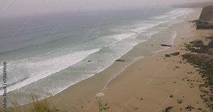 Cornwall seaside view with waves and cliffs