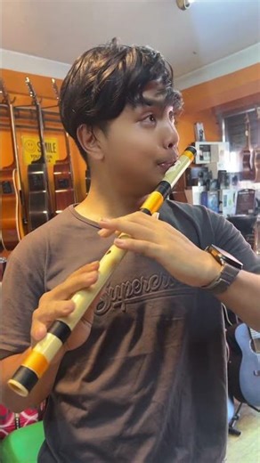 Testing a C scale flute — perfect harmony found! At Nepal Music Gallery