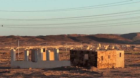 clip-3985904279-cinematic-desert-settlement-new-bedouin-houses-view
