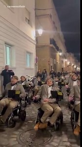 Dozens of Stephen Hawking performers take part in parade for charity