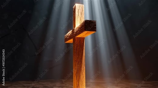 A wooden cross in a dark cave under the rays of the sun. Christianity, Easter, Epiphany, Christmas.