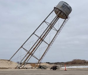 Watch as landmark water tower at site of a former N.J. factory comes crashing down