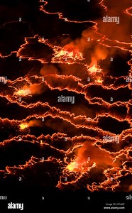 NYIRAGONGO, DR CONGO: STRIKING pictures and video from one of the world’s most destructive volcanos shows lava brimming as increased activity has led scientists to believe Africa will be shortly rocked by a potentially disastrous eruption. The pictures capture the bright red lava bubbling against the stark contrast of the dark ground in the pitch black of night at the Nyiragongo Volcano in the Democratic Republic of Congo – which travelled up to 37 miles-per-hour in a deadly magma stream which k
