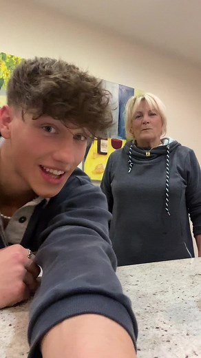 Playful Interaction Between Friends in Cozy Indoor Setting