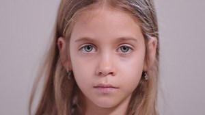 Playful girl sticking out tongue and teasing