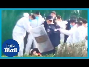 Foxconn workers RIOT at world's biggest Apple factory in China over Covid lockdown