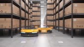 Autonomous robots moving shelves with cardboard boxes in automated...