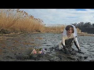 Playing in the mud in a wedding dress5