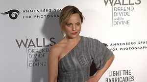 Mena Suvari wears chic silver dress to LA art exhibition opening
